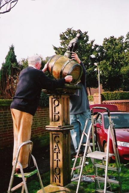 David Thompson, Parish chairman removes barrel from wooden post for the last time
